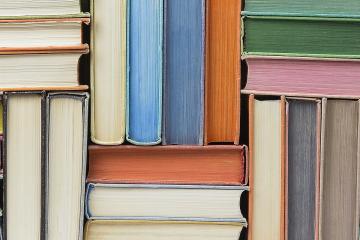 A photo of books of different colors