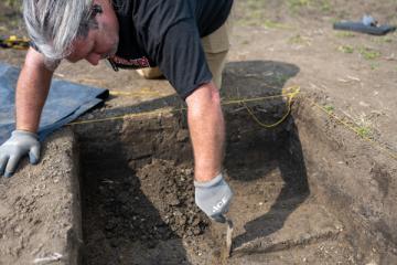 Archaeologist David Lamp works in a one-meter square part of a dig near Lancaster.