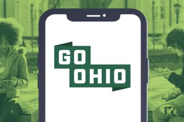 Image of phone with words "Go OHIO" atop a background photo of students