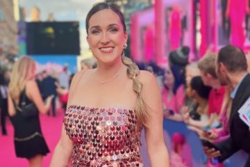 Kayla Carpenter on the pink carpet at the Barbie premiere in a pink sparkling gown