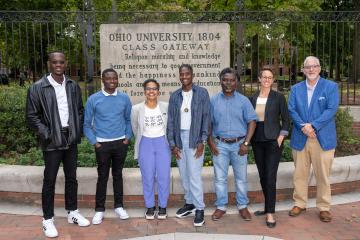 Students, faculty members and research clients pose in front of OHIO's Class Gateway 