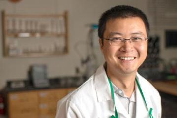 Professor Jixin Chen poses in a lab