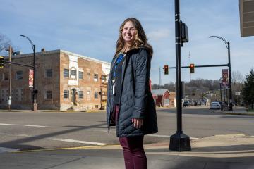 Lauren Nemeth, BSW '22, stands at an intersection in McArthur, Ohio.