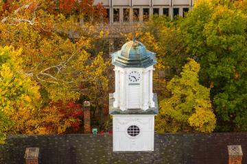 Cutler Hall is shown surrounded by colorful leaves during fall in Athens, Ohio