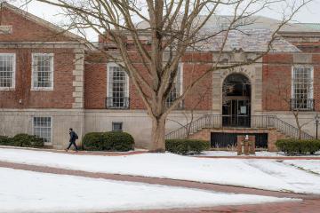 Chubb Hall and the College Green are shown on a snowy day in winter