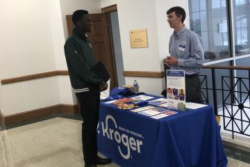 A recruiter from Kroger talks with an OHIO student