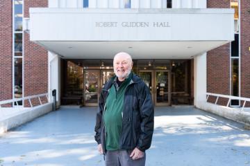Gary Clark stands in front of Glidden Hall, November 2022