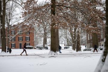 Students walk on OHIO's Athens Campus on a snowy, winter day