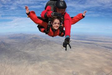Two people skydive