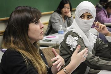 women speaking in a classroom 