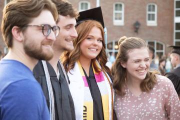OHIO graduates smile with family and friends  at the Ohio University Southern Graduation Recognition Ceremony