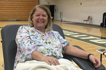 A professor prepares to donate blood at Shoemaker Center