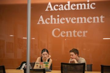 A student receives tutoring assistance at the Academic Achievement Center in Alden Library