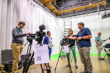 The Scripps Communication Fellows use video cameras in a classroom experience