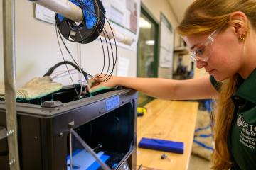 An OHIO student in the Russ College of Engineering and Technology works on a research project