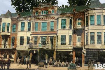 a historical photo of the former Hotel Berry, a three-story brick building; several men in period clothing sit and stand in front of the building, and a horse-drawn carriage can be seen in the street