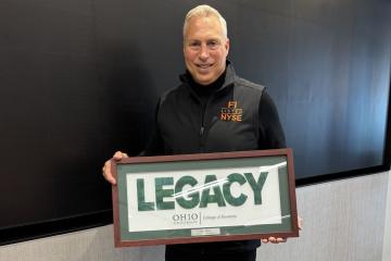 Tony Marino holds the Legacy Award