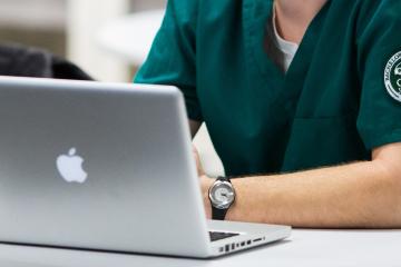 OHIO nursing student sitting with laptop 
