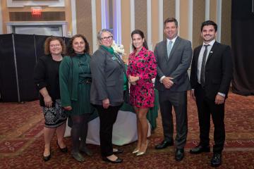 A group of faculty standing together, including Luisa Vilela de Souza Fauri, LAIOB's CEO and Janna Chimeli, the program director.