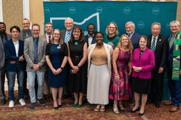 The winners of Global Engagement Awards and speakers from the event pose for a photo in the Baker Ballroom