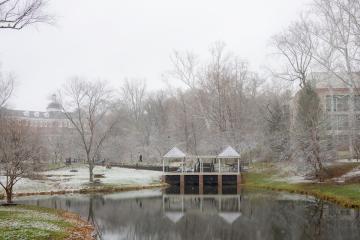 Emeriti Park is shown on a winter day with a dusting of snow in the trees on and the grass