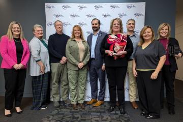 Representatives of the Small Business Development Center pose for a photo
