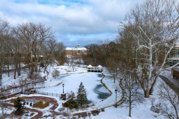 An aerial drone shot of the Athens campus on a snowy day in 2024