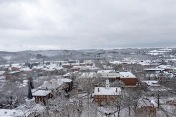 Cutler Hall, the College Green and the surrounding community is shown covered in snow in this aerial image
