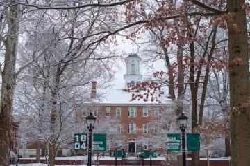 Cutler Hall and the College Green are shown covered in snow on a cold day in January 2025