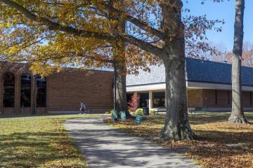 a student walk in front of Stevenson Center