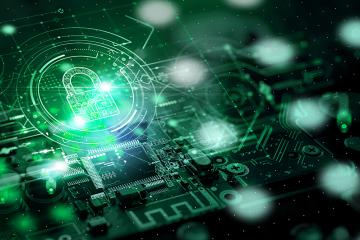 Rendered image: Green tinted circuits interwoven with a metallic green padlock, symbolizing cybersecurity. Associated with Ohio University.
