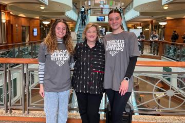 OHIO President Lori Stewart Gonzalez with two veteran students.