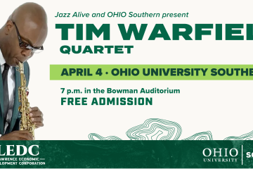 Tim Warfield playing saxophone in suit
