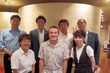 Ohio Unveristy student Nate Tegtmeyer standing amongst  six of his coworkers from Trancy