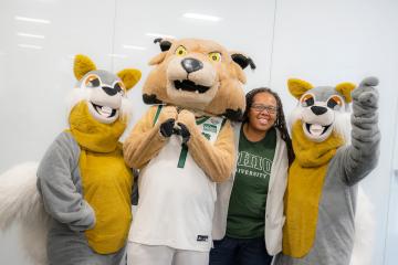 An OHIO leader poses for a photo with the Rufus and squirrel mascots
