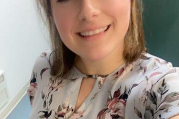 Portrait of young woman in flowered shirt