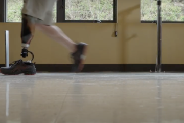 A prosthetic leg is shown on an individual who is walking