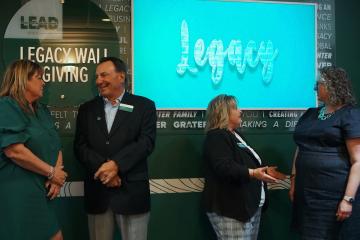OHIO leaders stand in front of the Legacy Wall in Copeland Hall