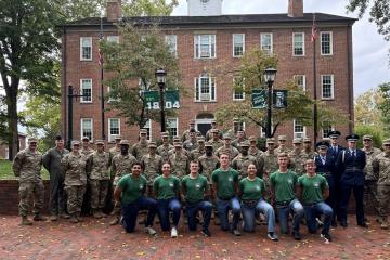 The members of Air Force ROTC Detachment 650 stand in front of Cutler Hall on the College Green