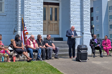 Marty Conley speaks at the dedication ceremony outside of the Quinn Chapel AME Church