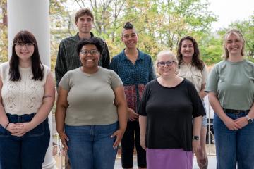 English graduate students and mentors pose for a picture outside Ellis Hall