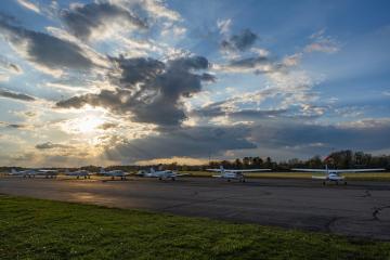Airplanes lined up at Ohio University Airport in the evening