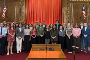 Participants in the Summer Law and Trial institute are shown in a courtroom with Jennifer Brunner