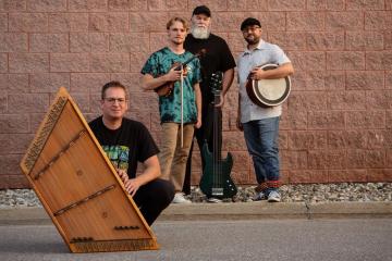 Ted Yoder Band pose with their instruments