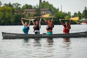 Helena Karlstrom and three other women are shown in a canoe out on the water