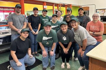 OHIO Zanesville students pose for a photo while working at the Christ's Table organization