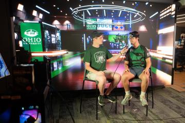 An OHIO esports broadcast member interviewing squad member after an event.