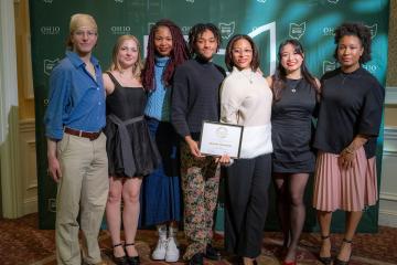 A group of OHIO students stands together and holds their award at the 2025 Leadership Awards event