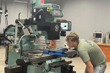 An OHIO students uses laboratory equipment at the Fairfield County Workforce Center
