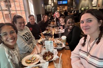 OHIO students and alumni eat a meal together